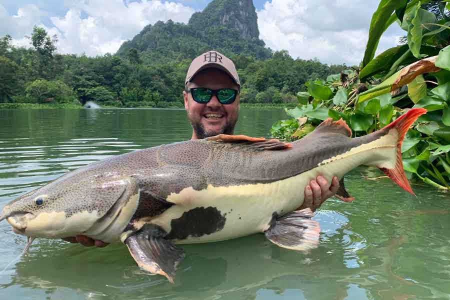 Paul Worsteling with an Asian Red Tailed Catfish